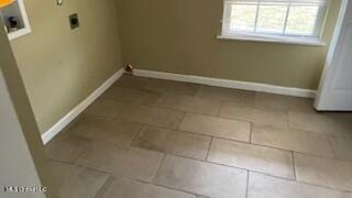 clothes washing area featuring washer hookup, tile patterned flooring, and hookup for an electric dryer