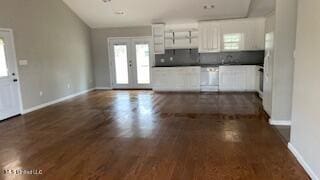 kitchen with white cabinetry, dark hardwood / wood-style flooring, and french doors