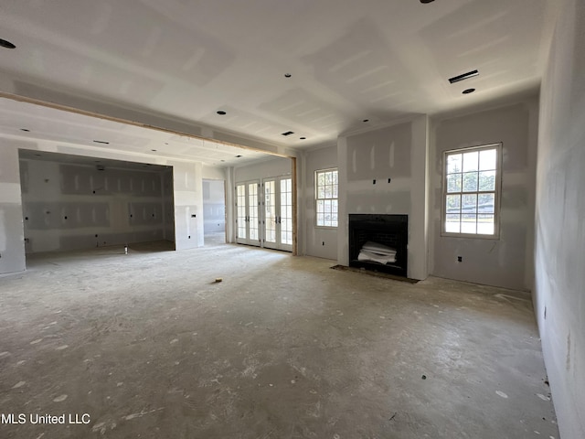 24 Waterstone Pl, Jackson, MS 39211 - unfurnished living room with a fireplace with flush hearth and french doors