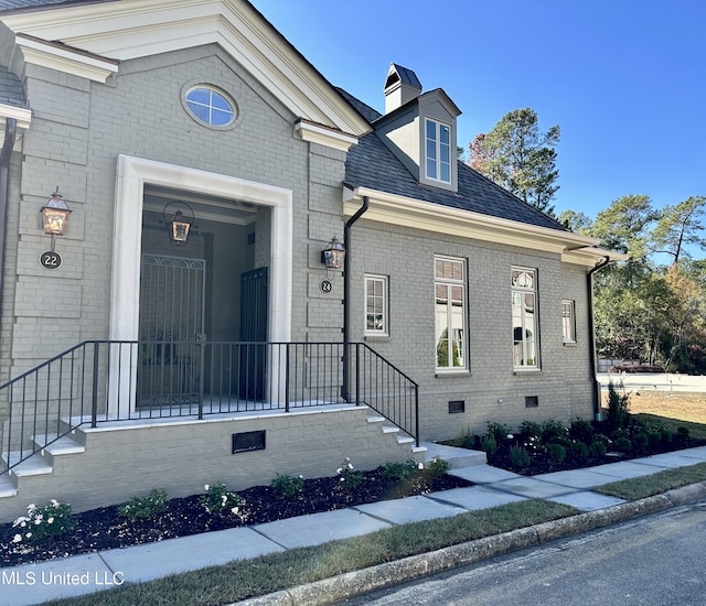 24 Waterstone Pl, Jackson, MS 39211 - view of property featuring crawl space, a shingled roof, and brick siding