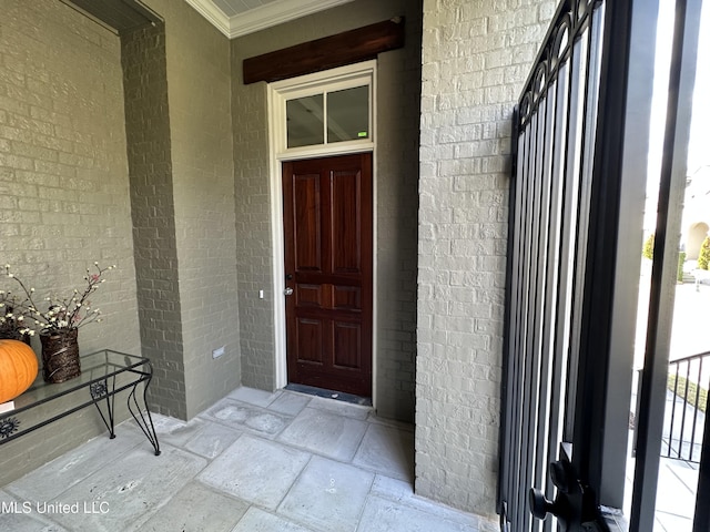 24 Waterstone Pl, Jackson, MS 39211 - doorway to property featuring covered porch and brick siding