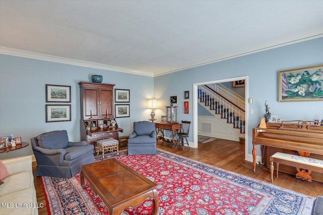 350 Whitfield Rd, Brandon, MS 39042 - living room featuring wood finished floors, stairs, and crown molding