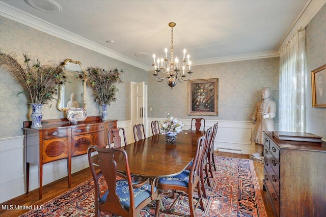 350 Whitfield Rd, Brandon, MS 39042 - dining room featuring light wood-type flooring, a chandelier, wainscoting, a baseboard radiator, and ornamental molding