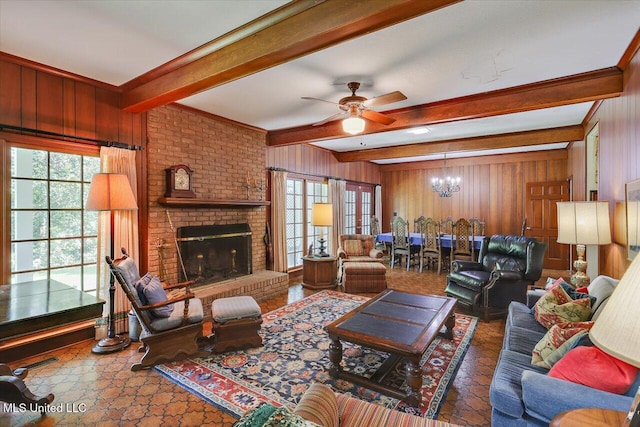 350 Whitfield Rd, Brandon, MS 39042 - living area with wooden walls, beam ceiling, a ceiling fan, a chandelier, and a fireplace