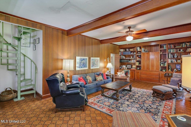 350 Whitfield Rd, Brandon, MS 39042 - living area with beam ceiling, wood walls, stairway, and a ceiling fan