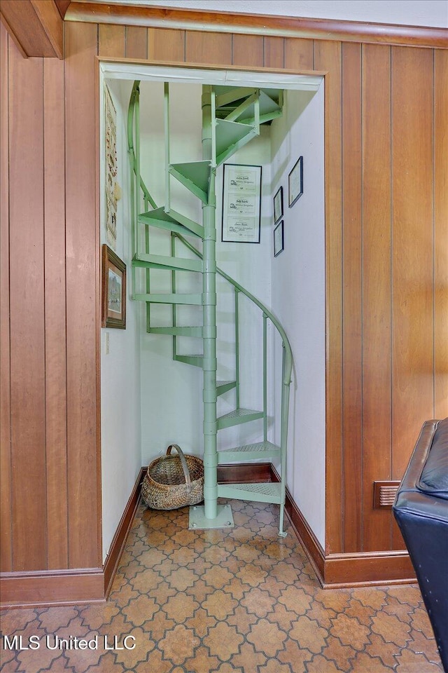 350 Whitfield Rd, Brandon, MS 39042 - staircase featuring wooden walls and tile patterned floors