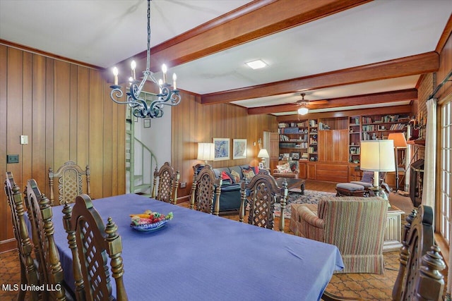350 Whitfield Rd, Brandon, MS 39042 - dining space with wooden walls, a chandelier, beamed ceiling, and a ceiling fan