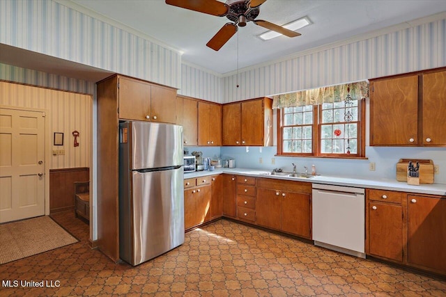 350 Whitfield Rd, Brandon, MS 39042 - kitchen featuring freestanding refrigerator, white dishwasher, light flooring, light countertops, and brown cabinetry