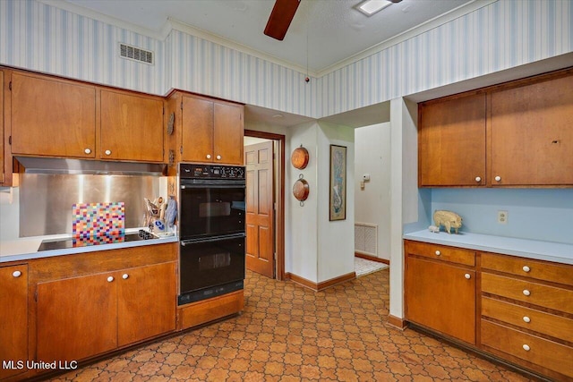 350 Whitfield Rd, Brandon, MS 39042 - kitchen featuring black appliances, light flooring, light countertops, brown cabinets, and ornamental molding