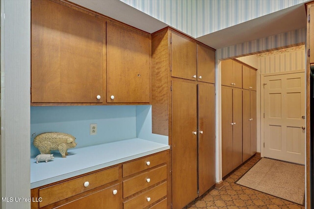 350 Whitfield Rd, Brandon, MS 39042 - kitchen with light countertops, brown cabinets, and light flooring