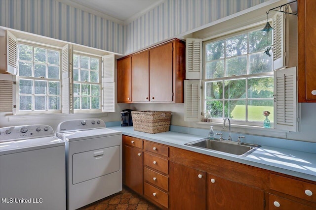350 Whitfield Rd, Brandon, MS 39042 - washroom with cabinet space, washer and clothes dryer, and wallpapered walls