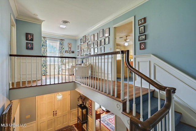 350 Whitfield Rd, Brandon, MS 39042 - staircase with a decorative wall, crown molding, and wainscoting