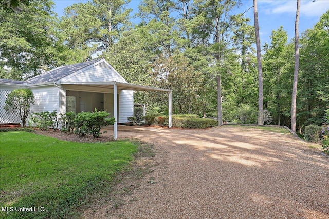 350 Whitfield Rd, Brandon, MS 39042 - view of yard with dirt driveway and a carport