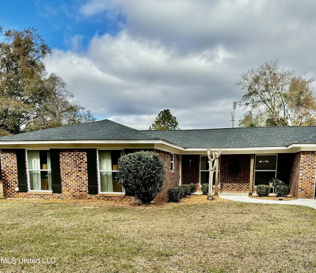 ranch-style house with a front lawn