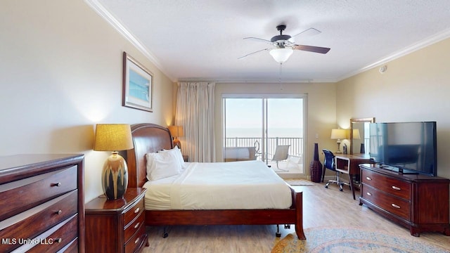 1200 Beach Dr Unit 806, Gulfport, MS 39507 - bedroom featuring access to exterior, ornamental molding, light wood-style flooring, a ceiling fan, and a desk