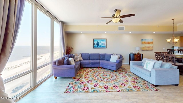1200 Beach Dr Unit 806, Gulfport, MS 39507 - living area featuring healthy amount of natural light, a chandelier, wood finished floors, crown molding, and a ceiling fan