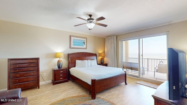1200 Beach Dr Unit 806, Gulfport, MS 39507 - bedroom with access to outside, wood finished floors, a ceiling fan, baseboards, and ornamental molding