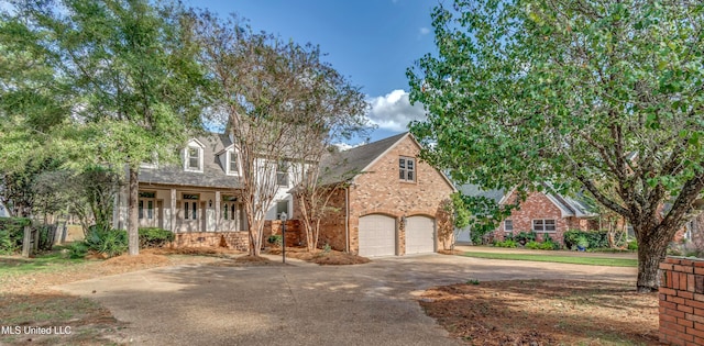 view of front of home featuring a garage and covered porch