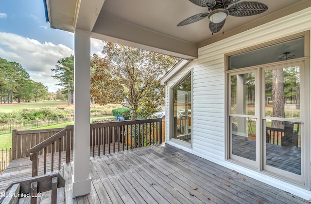 wooden deck with ceiling fan