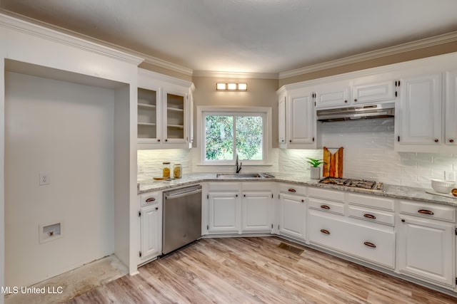 kitchen with white cabinetry, light stone counters, and appliances with stainless steel finishes