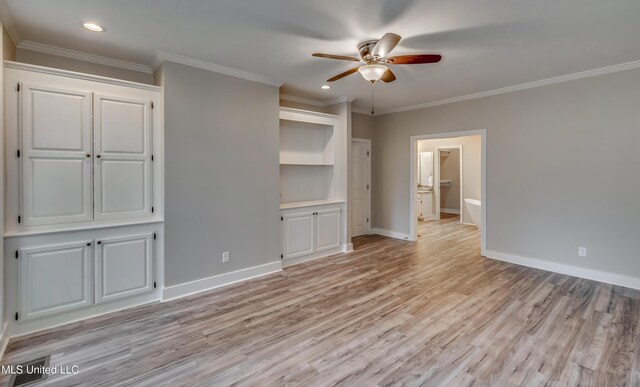 unfurnished bedroom featuring ornamental molding, light wood-type flooring, and ceiling fan