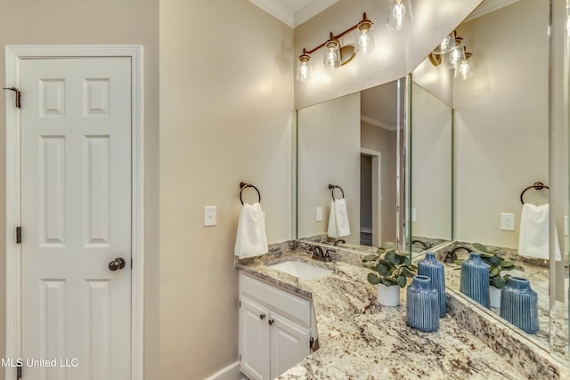 bathroom with vanity and ornamental molding