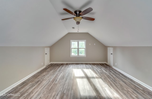 bonus room featuring light hardwood / wood-style flooring, ceiling fan, and vaulted ceiling