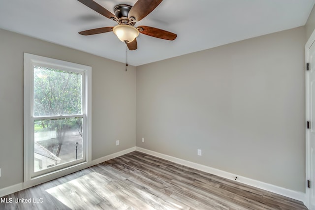 unfurnished room with light hardwood / wood-style floors and ceiling fan