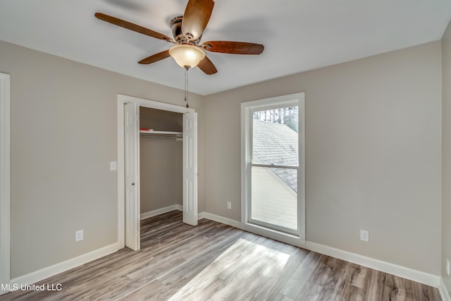 unfurnished bedroom with a closet, ceiling fan, and light hardwood / wood-style floors