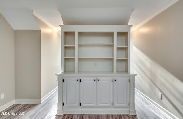 room details featuring wood-type flooring and crown molding