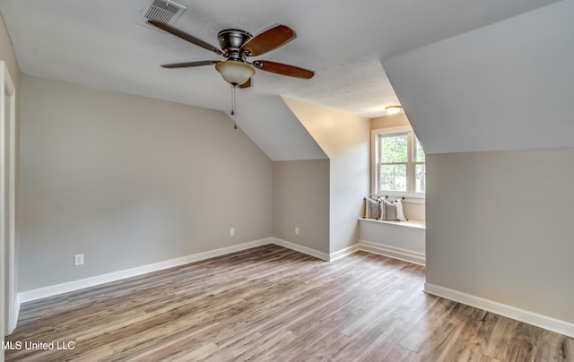 bonus room featuring lofted ceiling, ceiling fan, and light hardwood / wood-style flooring