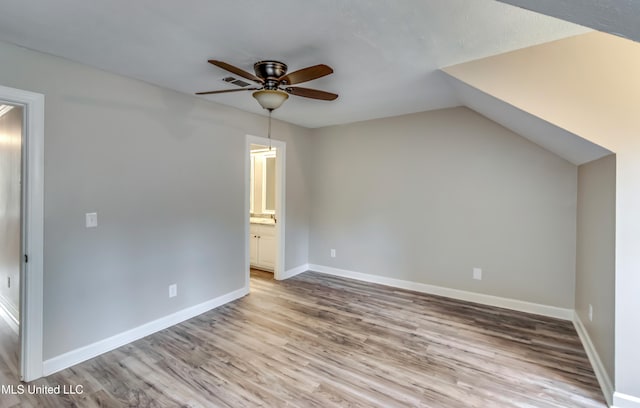 bonus room with light hardwood / wood-style flooring, lofted ceiling, and ceiling fan