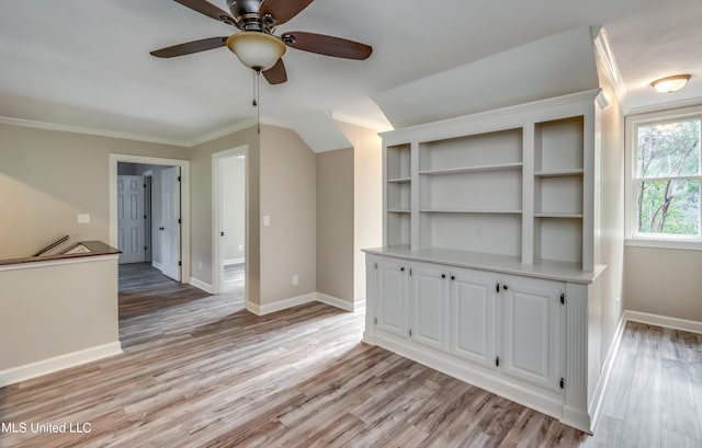 unfurnished living room with ceiling fan, light hardwood / wood-style floors, and crown molding