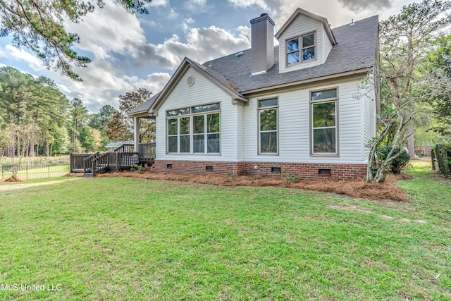 back of house featuring a yard