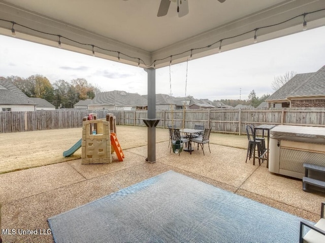 exterior space featuring a patio area and a hot tub