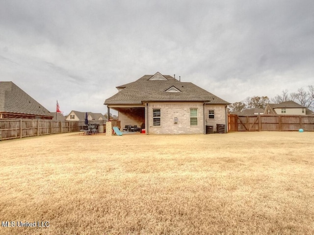 rear view of property featuring central AC