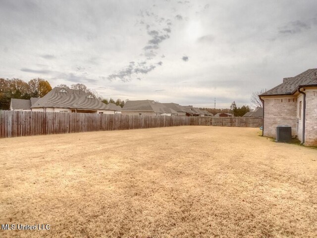 view of yard with central AC