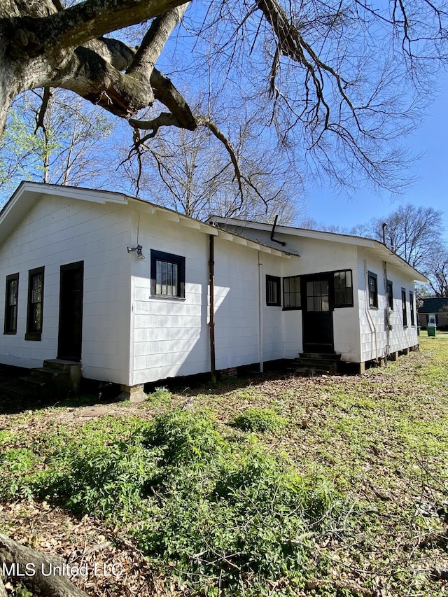 view of property exterior with entry steps