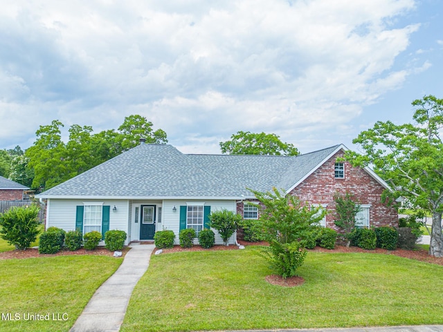 13360 Greenwich Cv, Gulfport, MS 39503 - view of front facade with a front yard, roof with shingles, and brick siding