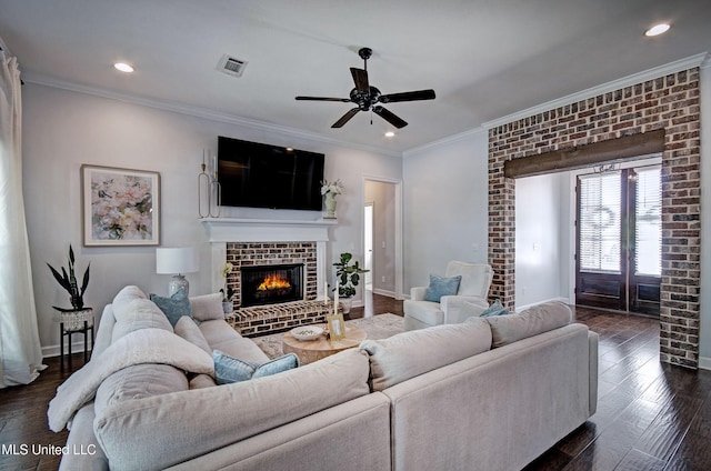 236 Cooper Ln, Canton, MS 39046 - living area featuring visible vents, baseboards, ceiling fan, a fireplace, and crown molding