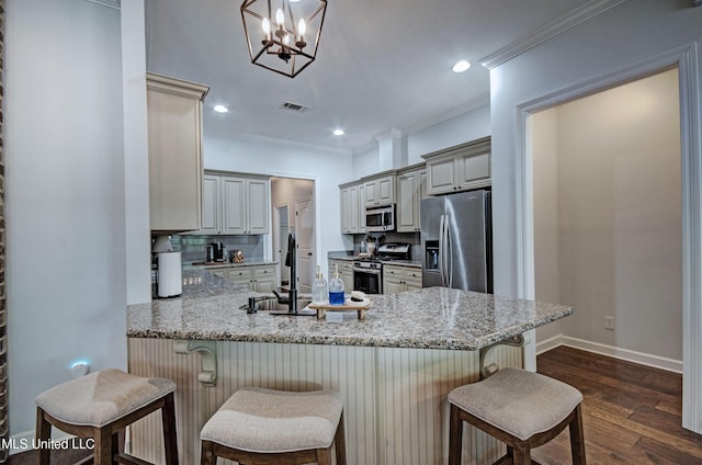 236 Cooper Ln, Canton, MS 39046 - kitchen featuring visible vents, ornamental molding, a peninsula, stainless steel appliances, and dark wood-type flooring