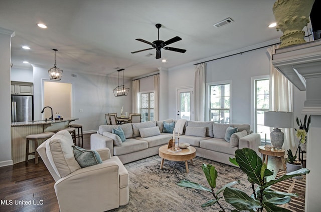 236 Cooper Ln, Canton, MS 39046 - living area with crown molding, ceiling fan with notable chandelier, visible vents, recessed lighting, and dark wood-style flooring