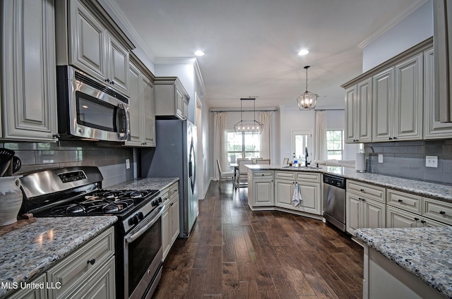 236 Cooper Ln, Canton, MS 39046 - kitchen with an inviting chandelier, light stone counters, a peninsula, dark wood finished floors, and stainless steel appliances