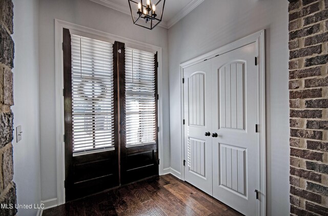 236 Cooper Ln, Canton, MS 39046 - foyer featuring dark wood-style flooring, baseboards, ornamental molding, a chandelier, and french doors