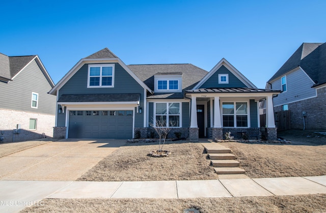 craftsman-style home with a porch and a garage