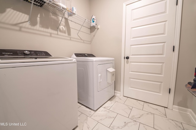 laundry area featuring washing machine and clothes dryer