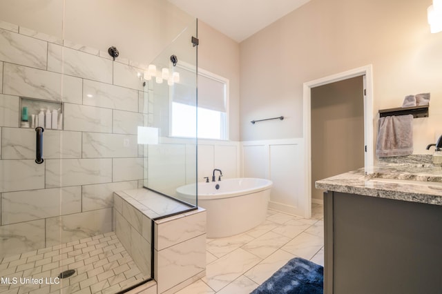 bathroom with vanity and separate shower and tub