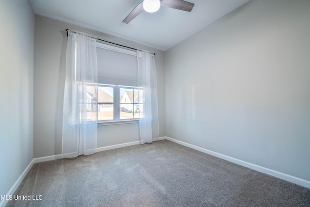 unfurnished room featuring lofted ceiling, carpet floors, and ceiling fan