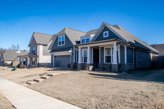 view of front of property with a garage and a porch