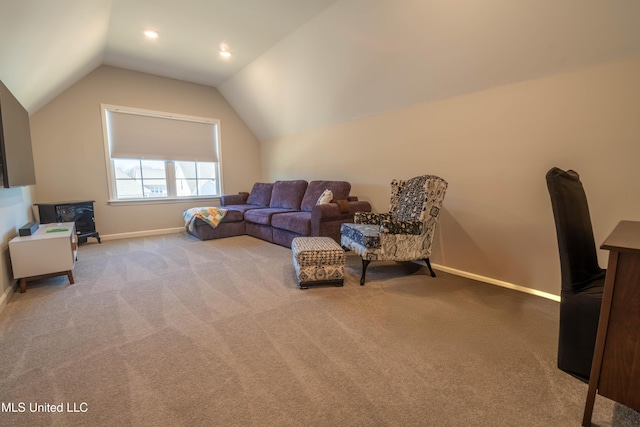 carpeted living room featuring lofted ceiling